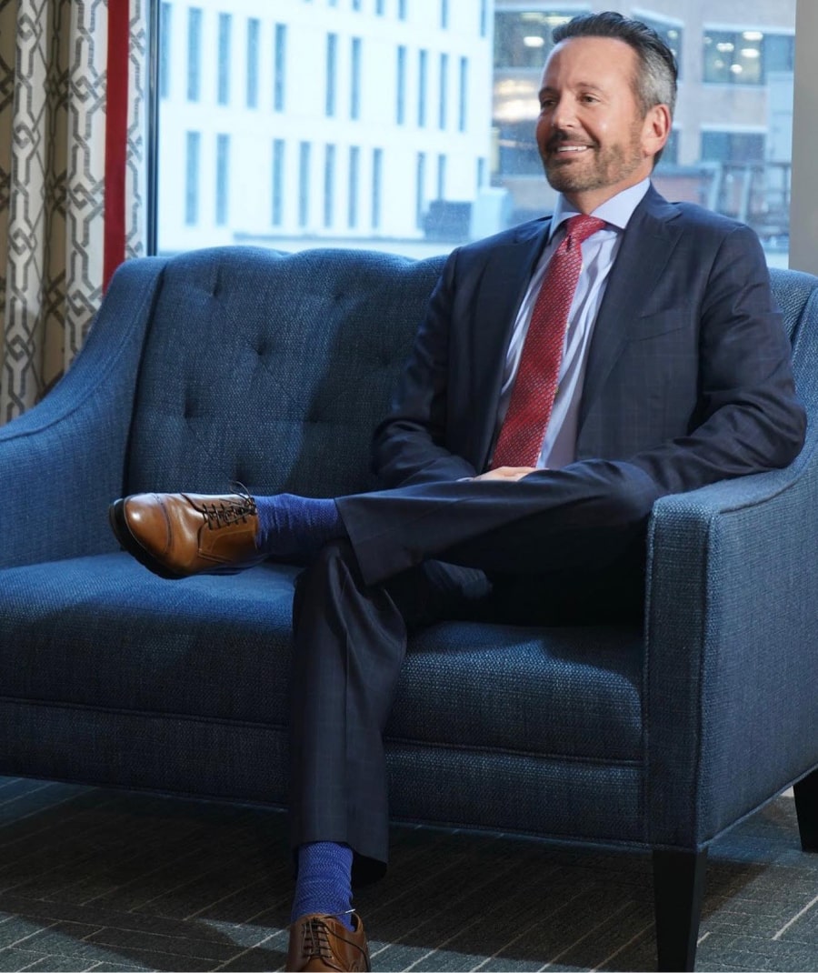 Brent Saunders sitting in a blue chair