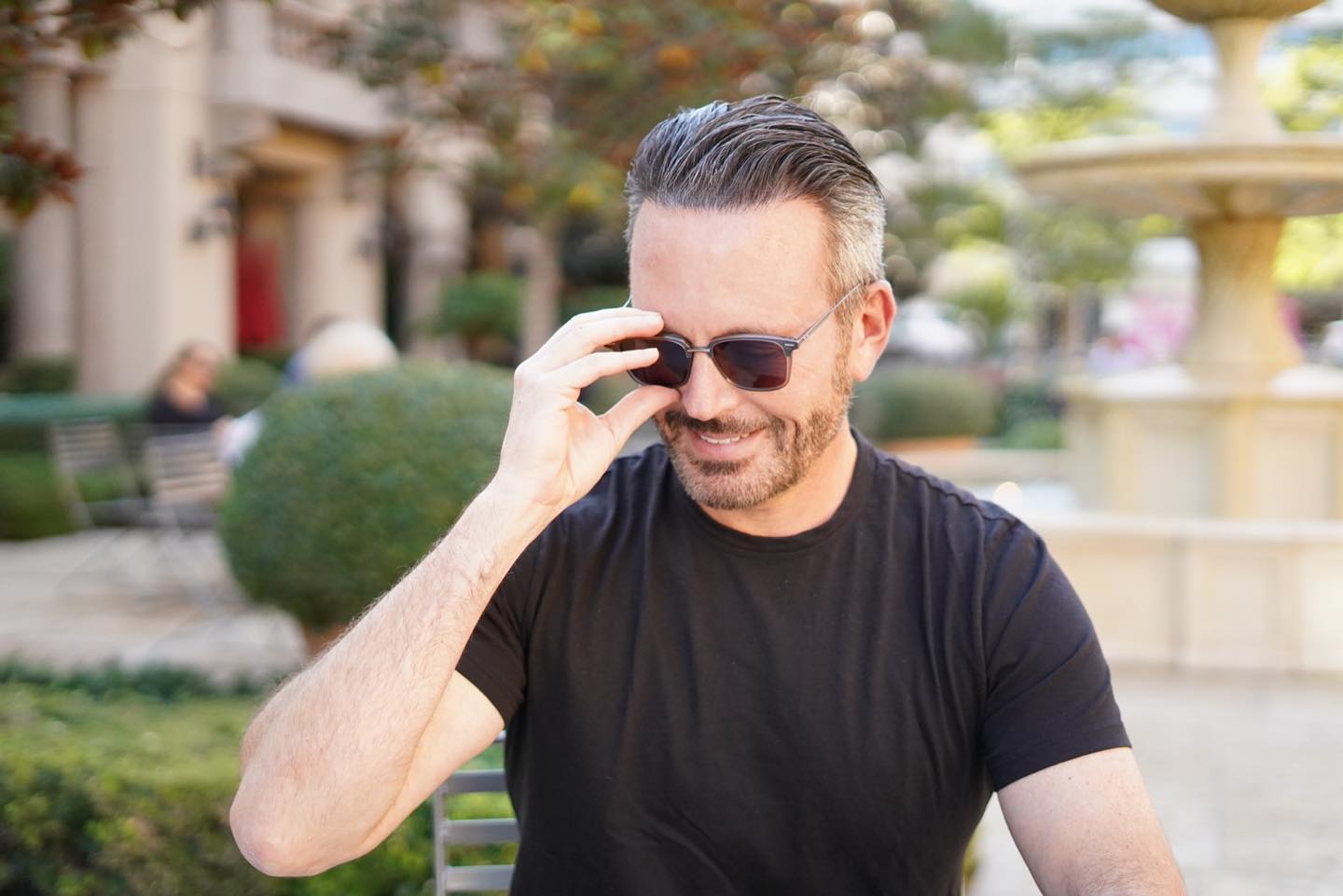 Brent Saunders sitting outside wearing sunglasses